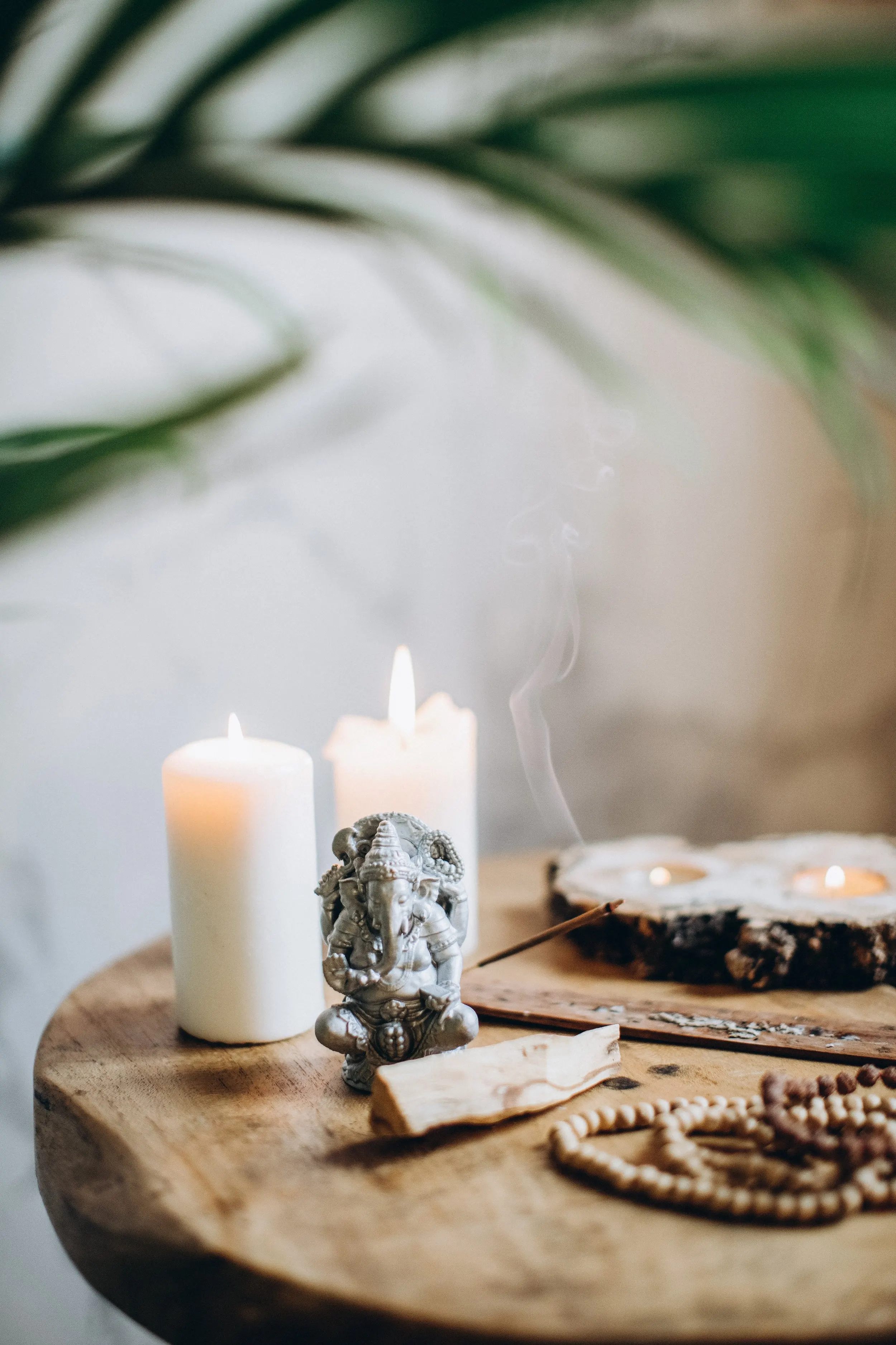 Candles and tea lights on a wooden table